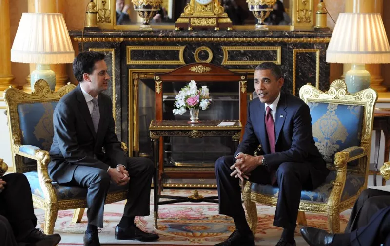 US President Barack Obama (R) meets Leader of Britain's opposition Labour Party Ed Miliband at Buckingham Palace, in central London, on May 24, 2011. US President Barack Obama basked Tuesday in the royal pageantry of a state visit to Britain, given an extra dash of glamour by a brief encounter with Prince William and his new bride Catherine. The president and his wife Michelle were welcomed by Queen Elizabeth II and a 41-gun salute in the gardens of Buckingham Palace at the start of a two-day visit mixing pomp with serious diplomacy.  AFP PHOTO / JEWEL SAMAD