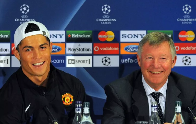 Manchester United's Portuguese midfielder Cristiano Ronaldo (L) and manager Sir Alex Ferguson attend a press conference in Manchester, north west England on April 6, 2009. Manchester United take on Porto in their UEFA Champions League quarter final first leg football match on April 7. AFP PHOTO/Paul Ellis