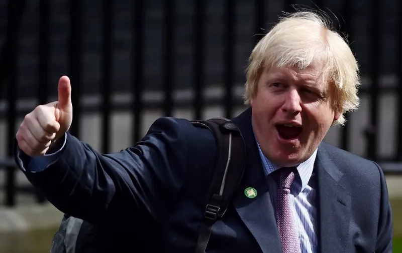 London Mayor and newly-elected Conservative member of parliament, Boris Johnson, gives a thumbs-up as he leaves arrives a meeting at 10 Downing Street in central London on May 11, 2015. Conservative Prime Minister David Cameron continued to appoint members of the government after a shock election victory in the May 7 general election.  AFP PHOTO / BEN STANSALL