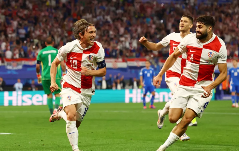 Soccer Football - Euro 2024 - Group B - Croatia v Italy - Leipzig Stadium, Leipzig, Germany - June 24, 2024  Croatia's Luka Modric celebrates scoring their first goal with Josko Gvardiol REUTERS/Lisi Niesner