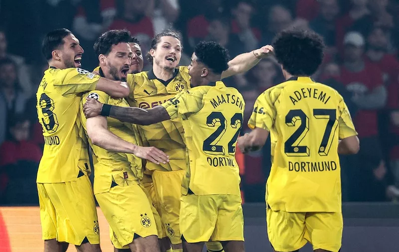Dortmund's German defender #15 Mats Hummels (2L) celebrates with teammates after he scored his teams first goal during the UEFA Champions League semi-final second leg football match between Paris Saint-Germain (PSG) and Borussia Dortmund, at the Parc des Princes stadium in Paris on May 7, 2024. (Photo by FRANCK FIFE / AFP)