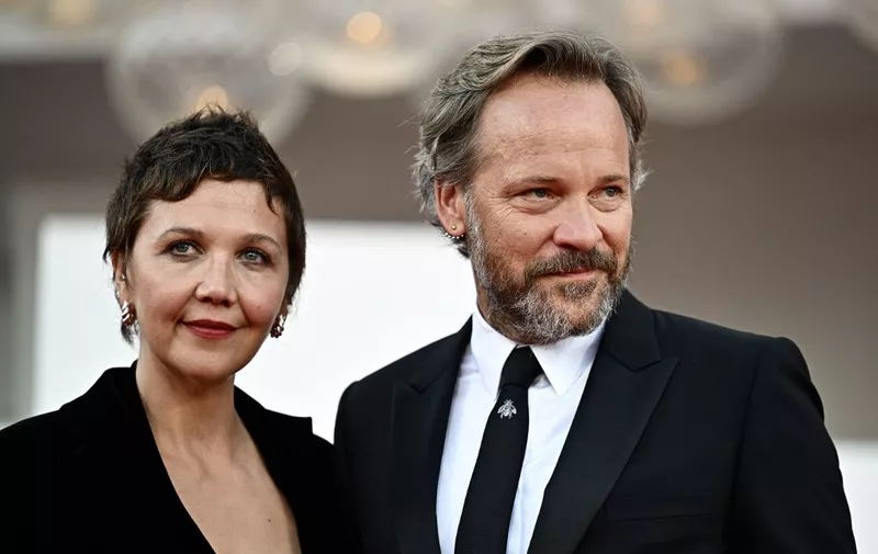 Maggie Gyllenhaal and actor Peter Sarsgaard attend the red carpet of the closing ceremony of the 80th Venice Film Festival on September 9, 2023 at Venice Lido. (Photo by GABRIEL BOUYS / AFP)