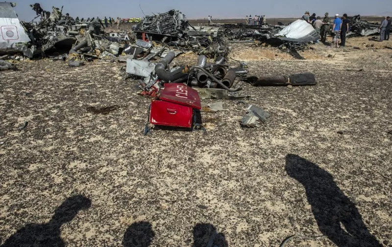Debris of the A321 Russian airliner lie on the ground a day after the plane crashed in Wadi al-Zolomat, a mountainous area in Egypt's Sinai Peninsula, on November 1, 2015. International investigators began probing why the Russian airliner carrying 224 people crashed in the Sinai Peninsula, killing everyone on board, as rescue workers widened their search for missing victims. AFP PHOTO / KHALED DESOUKI