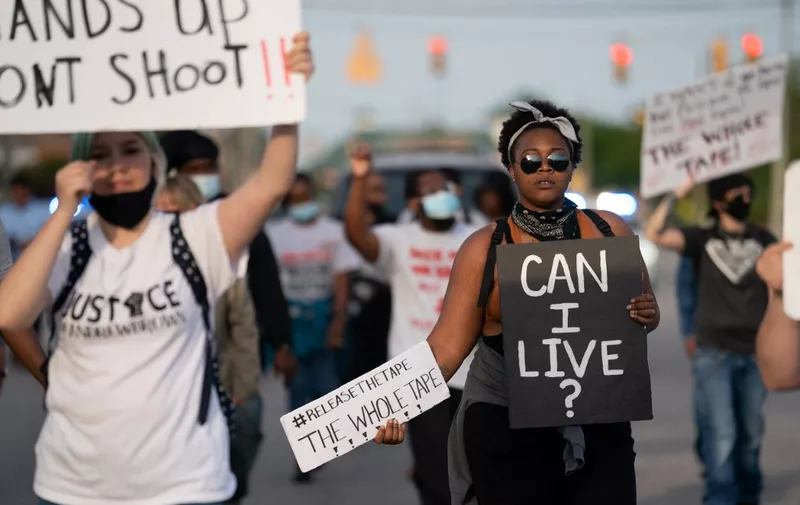 ELIZABETH CITY, NC - MAY 11: Protestors march in the street after a news conference addressing police video footage of the shooting death of Andrew Brown Jr. on May 11, 2021 in Elizabeth City, North Carolina. Brown was shot and killed by officers from the Pasquotank County Sheriff's Office on April 21.   Sean Rayford/Getty Images/AFP (Photo by Sean Rayford / GETTY IMAGES NORTH AMERICA / Getty Images via AFP)