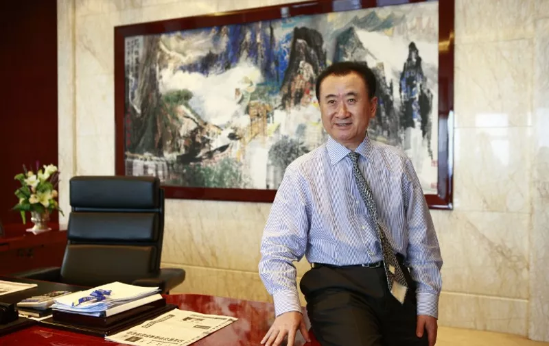--FILE--Wang Jianlin, Chairman of Dalian Wanda Group, is pictured at an interview in Beijing, China, 29 August 2012. 

Chinese real estate mogul Wang Jianlin became the richest man in Asia, data showed on Monday (4 May 2015), beating Alibaba Group's Jack Ma Yun and Li Ka-shing, chairman of Hong Kong-based Hutchison Whampoa. The total wealth of Wang, chairman of conglomerate Dalian Wanda Group, reached $38.1 billion as of Monday, according to the Bloomberg billionaire index, ranking him No.1 in Asia and putting him 11th on the world rich list. Analysts said that the rise of Wang in the rich list was mainly attributed to the recent surge in share prices of companies controlled by Wang and his family. Shares in Dalian Wanda Commercial Properties Co, a Hong Kong-listed firm under Wanda Group, rose 2.75 percent on Monday to HK$65.4 ($8.44) per share. The company's market value has topped HK$300 billion for the first time on Monday. Wang and his family own around 50 percent of the company's shares, worth some $20 billion at present, according to a report on finance news portal money.163.com on Monday. Wang also controls a 60.71 percent stake in Shenzhen-listed Wanda Cinemas and a 78 percent stake in AMC Entertainment Holdings, which is listed on the New York Stock Exchange and was acquired by Wanda in 2012, according to the report.