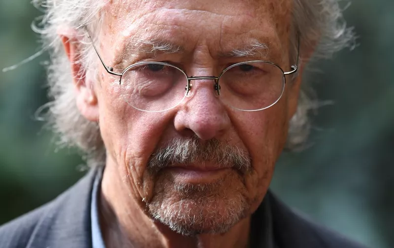 Austrian writer Peter Handke poses in Chaville, in the Paris surburbs, on October 10, 2019 after he was awarded with the 2019 Nobel Literature Prize. - Austrian Peter Handke, one of the most original German-language writers alive, who once used his famously sharp tongue to call for the Nobel Prize in Literature to be abolished, was awarded with the 2019 Nobel Literature Prize on October 10. The prize brings its winner "false canonisation" along with "one moment of attention (and) six pages in the newspaper," the novelist, playwright, poet and translator told Austrian media in 2014. (Photo by Alain JOCARD / AFP)