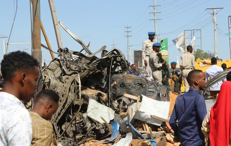 The wreckage of a car that was destroyed during the car bomb that exploded in Mogadishu that killed more than 20 people is photographed in Mogadishu on December 28, 2019. - A massive car bomb exploded in a busy area of the Somali capital Mogadishu on December 28, 2019, leaving more than 20 people dead. (Photo by Abdirazak Hussein FARAH / AFP)