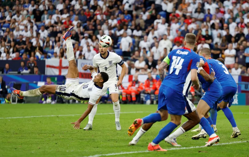 Soccer Football - Euro 2024 - Round of 16 - England v Slovakia - Arena AufSchalke, Gelsenkirchen, Germany - June 30, 2024 England's Jude Bellingham scores their first goal REUTERS/John Sibley