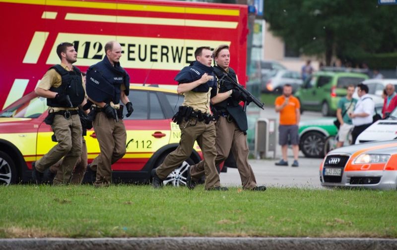 Police walks near a shopping mall amid a shooting on July 22, 2016 in Munich.
Several people were killed on Friday in a shooting rampage by a lone gunman in a Munich shopping centre, media reports said / AFP PHOTO / dpa / Matthias Balk / Germany OUT