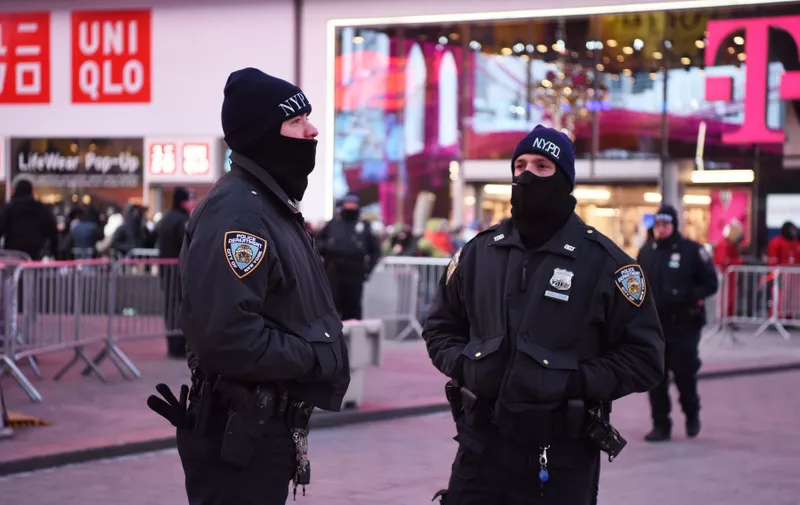 (171231) -- NEW YORK, Dec. 31, 2017  -- Police officers stand guard at Times Square in New York, the United States, on Dec. 31, 2017. Security measures are tightened for the upcoming New Year celebration., Image: 359038929, License: Rights-managed, Restrictions: WORLDWIDE RIGHTS AVAILABLE EXCLUDING CHINA, HONG KONG ONLY. End users shall not licence, sell, transmit, or otherwise distribute any photographs represented by eyevine, to any third party. Contact eyevine for more information: Tel: +44 (0) 20 8709 8709 Ema, Model Release: no, Credit line: Profimedia, Eyevine