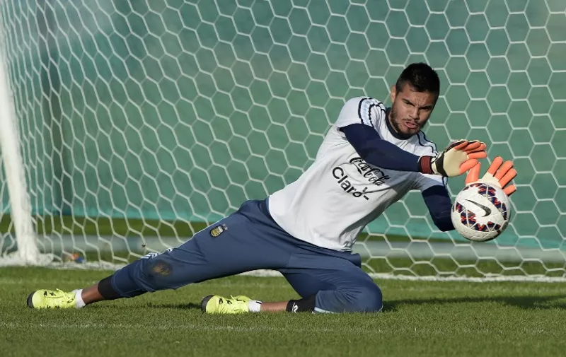 Argentina's goalkeeper Sergio Romero stops the ball during a training session in La Serena, Coquimbo, Chile, on June 23, 2015 ahead the Copa America quarterfinal football match against Colombia to be held in Vina del Mar on June 26. AFP PHOTO / JUAN MABROMATA