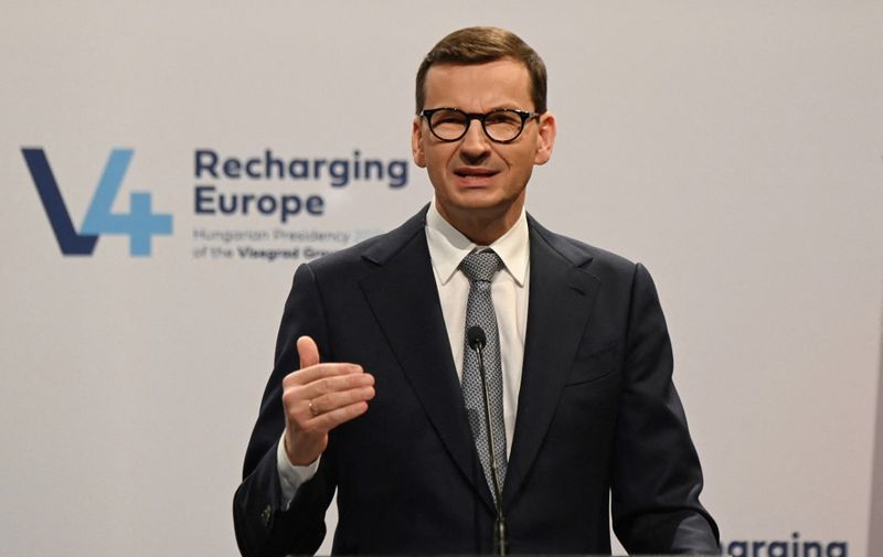Poland's Prime Minister Mateusz Morawiecki gives a press conference following a meeting of prime ministers of central Europe's informal body of cooperation, called the Visegrad Group (V4) in Budapest, Hungary, on November 4, 2021. (Photo by ATTILA KISBENEDEK / AFP)