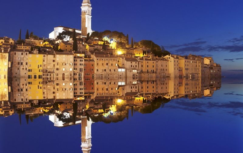 Old town with cathedral of St. Euphemia reflecting in the water at night, Istria, Croatia, Europe (Photo by Markus Lange / Robert Harding Premium / robertharding via AFP)