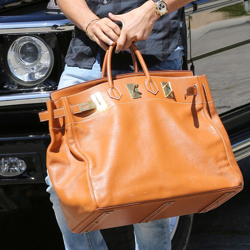 Beverly Hills, CA - Part 2 - Scott Disick arrives at Kim Kardashian's house in Beverly Hills this afternoon, toting around a brown Hermes Birkin bag.  Scott was dressed casual in a plaid shirt with distressed jeans.  The reality star was out without long-time beau, Kourtney Kardashian amidst recent rumors that Scott may not be Mason's biological father.  
           April 4, 2013,Image: 157874401, License: Rights-managed, Restrictions: World Rights,World Rights, Model Release: no, Pictured: Scott Disick