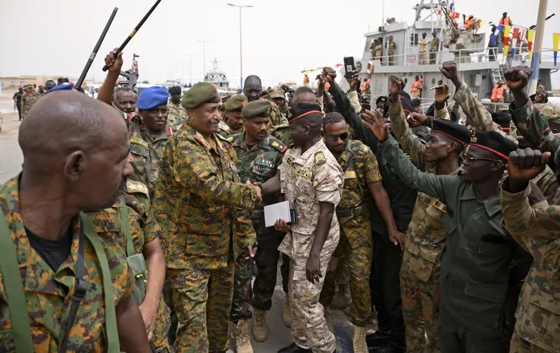 Sudanese army chief Abdel Fattah al-Burhan visits the Flamingo Marine Base in Port Sudan on August 28, 2023. The war between Burhan and his former deputy Mohamed Hamdan Daglo, who commands the paramilitary Rapid Support Forces (RSF), has raged since April 15, spreading from Khartoum and Darfur to Kordofan and Jazira state, killing thousands and forcing millions to flee their homes. (Photo by AFP)