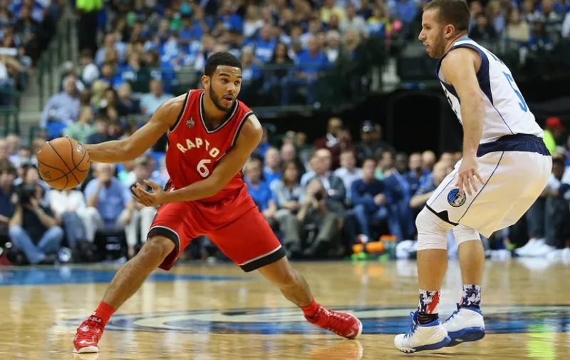 DALLAS, TX - NOVEMBER 03: Cory Joseph #6 of the Toronto Raptors dribbles the ball against J.J. Barea #5 of the Dallas Mavericks at American Airlines Center on November 3, 2015 in Dallas, Texas. NOTE TO USER: User expressly acknowledges and agrees that, by downloading and or using photograph, User is consenting to the terms and conditions of the Getty Images License Agreement.   Ronald Martinez/Getty Images/AFP