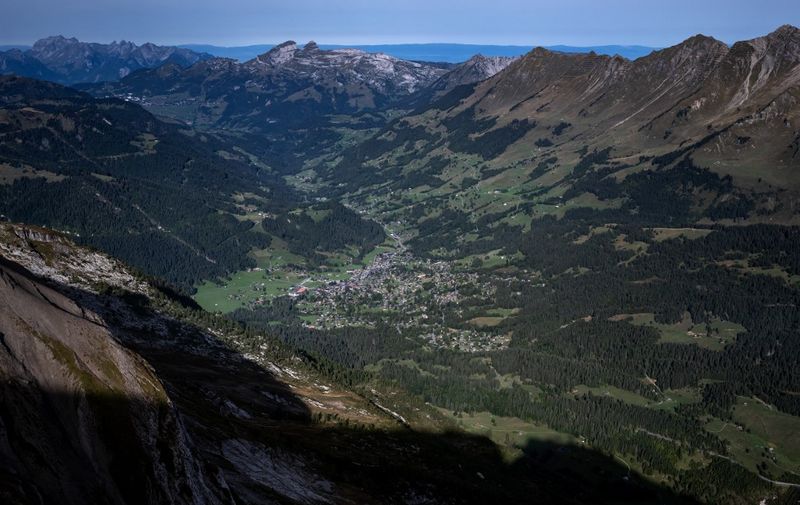 This photograph taken on September 13, 2022 from Glacier 3000 resort shows the village of Les Diablerets in the Swiss Alps. (Photo by Fabrice COFFRINI / AFP)