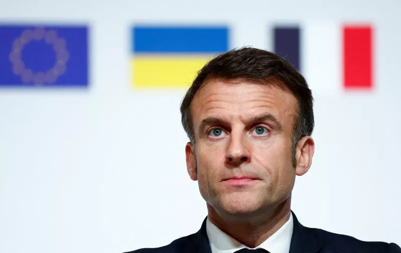 French President Emmanuel Macron looks on during a press conference at the end of the international conference aimed at strengthening Western support for Ukraine, at the Elysee presidential palace in Paris, on February 26, 2024. The meeting at the Elysee Palace will be a chance for participants to "reaffirm their unity as well as their determination to defeat the war of aggression waged by Russia in Ukraine", the French presidency said. (Photo by GONZALO FUENTES / POOL / AFP)