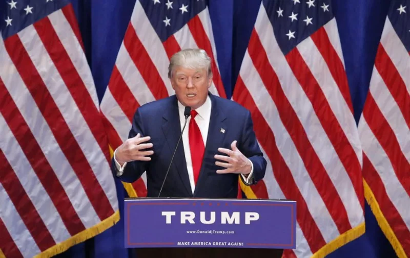 Real estate mogul Donald Trump announces his bid for the presidency in the 2016 presidential race during an event at the Trump Tower on the Fifth Avenue in New York City on June 16, 2015. Trump, one of America's most flamboyant and outspoken billionaires, threw his hat into the race Tuesday for the White House, promising to make America great again. The 69-year-old long-shot candidate ridiculed the country's current crop of politicians and vowed to take on the growing might of China in a speech launching his run for the presidency in 2016. "I am officially running for president of the United States and we are going to make our country great again," he said from a podium bedecked in US flags at Trump Tower on New York's Fifth Avenue. The tycoon strode onto the stage after sailing down an escalator to the strains of "Rockin' In The Free World" by Canadian singer Neil Young after being introduced by daughter Ivanka. His announcement follows years of speculation that the man known to millions as the bouffant-haired host of American reality TV game show "The Apprentice" would one day enter politics. Trump identifies himself as a Republican, and has supported Republican candidates in the past. But in his announcement speech he did not explicitly say if he was running for the party's nomination or as an independent.AFP PHOTO/ KENA BETANCUR
