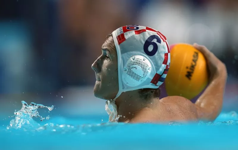 Luka Bukic of Croatia looks to pass the ball during the men's final water polo match between Croatia and Serbia on day fifteen of the 16th FINA World Championships at the Water Polo Arena on August 8, 2015 in Kazan, Russia. Serbia won 11-4. AFP PHOTO / ROMAN KRUCHININ / AFP PHOTO / ROMAN KRUCHININ