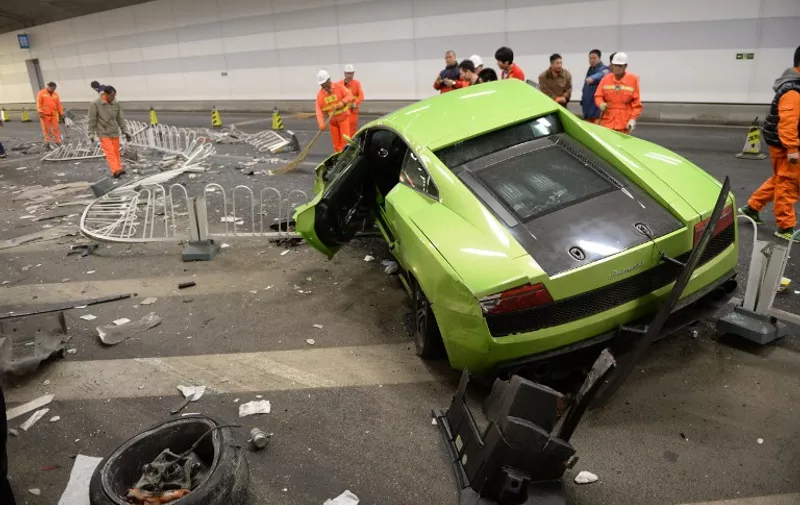 This photo taken early on April 12, 2015 shows a badly damaged Lamborghini car and debris in a tunnel after a crash involving a Ferrari in Beijing. The two cars crashed late on April 11 in a high-speed road race in Beijing as the seventh stunt-filled &#8220;Fast and the Furious&#8221; movie opened in China, the [&hellip;]