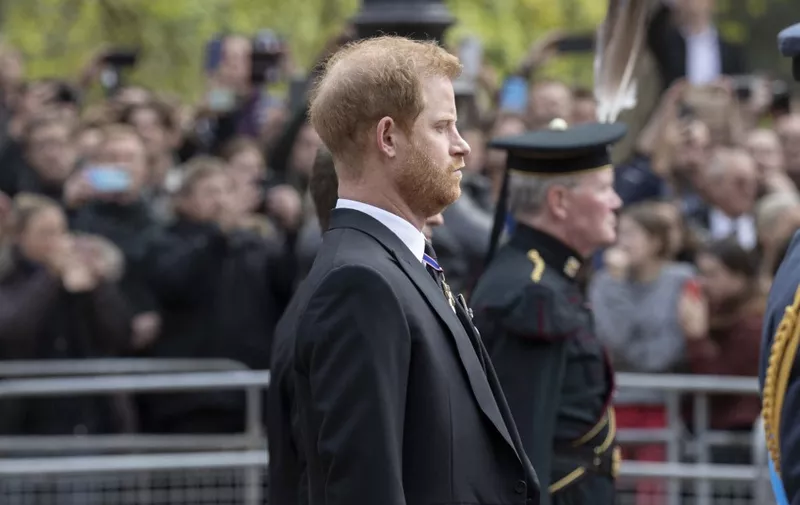 LONDON, UNITED KINGDOM – SEPTEMBER 19: Prince Harry Duke of Sussex walks behind the coffin of Queen Elizabeth II as it travels in a procession from Westminster Abbey to Wellington Arch in London, United Kingdom on September 19, 2022. The state funeral of Queen Elizabeth II, Britain’s longest reigning monarch, is expected to be watched by millions of people in the UK and abroad with hundreds of thousands lining the streets in London and Windsor to pay their respects on her final journey. Rasid Necati Aslim / Anadolu Agency (Photo by Rasid Necati Aslim / ANADOLU AGENCY / Anadolu Agency via AFP)