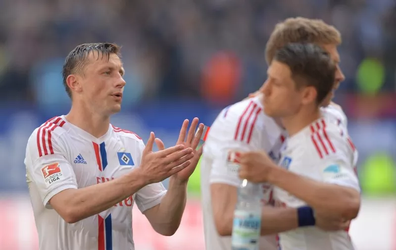 Hamburg's Croatian forward Ivica Olic reacts after German first division Bundesliga football match between Hamburg SV and FC Schalke 04 at the Imtech Arena in Hamburg, northern Germany on May 23, 2015. Hamburg won the match 2-0 and will play a relagation match to stay in the 1st Division.  AFP PHOTO / OLIVER LANG

RESTRICTIONS - DFL RULES TO LIMIT THE ONLINE USAGE DURING MATCH TIME TO 15 PICTURES PER MATCH. IMAGE SEQUENCES TO SIMULATE VIDEO IS NOT ALLOWED AT ANY TIME. FOR FURTHER QUERIES PLEASE CONTACT DFL DIRECTLY AT + 49 69 650050.