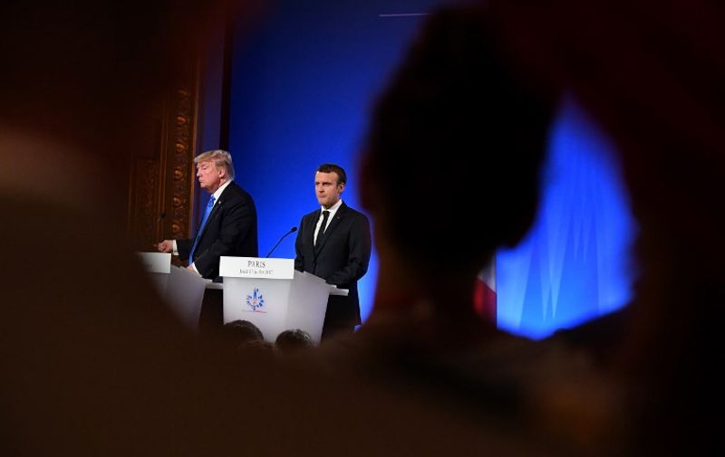 US President Donald Trump (L) and French President Emmanuel Macron (R) address a press conference following meetings at the Elysee Palace in Paris, on July 13, 2017, during the US president's 24-hour trip that coincides with France's national day and the 100th anniversary of US involvement in World War I.
Donald Trump arrived in Paris for a presidential visit filled with Bastille Day pomp and which the White House hopes will offer respite from rolling scandal backing home.
 / AFP PHOTO / ALAIN JOCARD