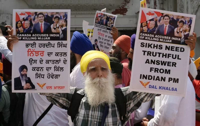 Activists of the Dal Khalsa Sikh organisation, a pro-Khalistan group, stage a demonstration demanding justice for Sikh separatist Hardeep Singh Nijjar, who was killed in June 2023 near Vancouver, after offering prayers at the at Akal Takht Sahib in the Golden Temple in Amritsar on September 29, 2023. (Photo by Narinder NANU / AFP)