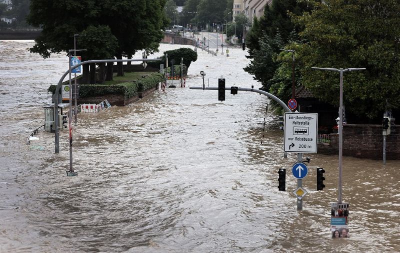 The historic part of Heidelberg is flooded during high water of the Neckar river in Heidelberg, southwestern Germany on June 3, 2024. The Neckar river is around 3 meters above is regular level and will reach its peak of approximately 5,1 meter during the day. (Photo by Daniel ROLAND / AFP)