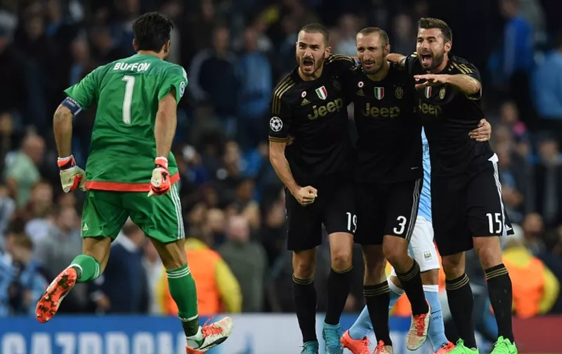 (L-R) Juventus' goalkeeper from Italy Gianluigi Buffon, Juventus' defender from Italy Leonardo Bonucci, Juventus' defender from Italy Giorgio Chiellini and Juventus' defender from Italy Andrea Barzagli celebrate after winning a UEFA Champions League group stage football match between Manchester City and Juventus at the Etihad stadium in Manchester, north-west England on September 15, 2015.   AFP PHOTO / PAUL ELLIS