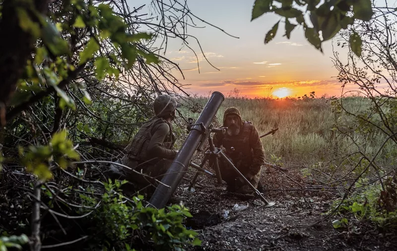 DONETSK OBLAST, UKRAINE - AUGUST 21: Ukrainian soldiers prepare 120mm mortar to fire, in the direction of Bakhmut frontline as the Russia-Ukraine war continues in Donetsk Oblast, Ukraine on August 21, 2023. Diego Herrera Carcedo / Anadolu Agency/ABACAPRESS.COM,Image: 799517659, License: Rights-managed, Restrictions: , Model Release: no