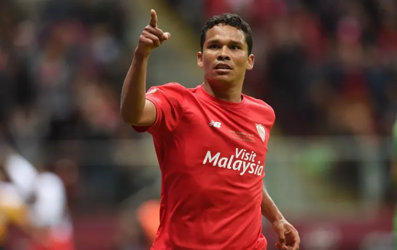 Sevilla's Colombian forward Carlos Bacca reacts after scoring during the UEFA Europa League final football match between FC Dnipro Dnipropetrovsk and Sevilla FC at the Narodowy stadium in Warsaw, Poland on May 27, 2015.    AFP PHOTO / PIOTR HAWALEJ