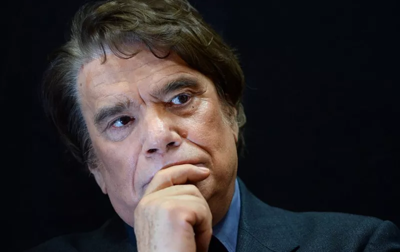 (FILES) - A photo taken on November 15, 2013 shows French businessman Bernard Tapie, owner of the French newspaper La Provence, posing as he attends the inauguration of an auto show in Marseille, southern France.
Bernard Tapie will have to pay back 404,623,082.54 euros obtained in 2008, to put an end to a dispute with the French banking group Credit Lyonnais concerning the resale of the Adidas company in 1994, the Paris appeal aourt announced on December 3, 2015. / 