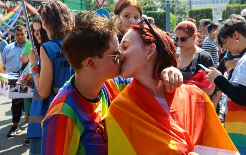 Participants kiss during the lesbian, gay, bisexual and transgender (LGBT) Pride Parade in Budapest on July 24, 2021. (Photo by FERENC ISZA / AFP)