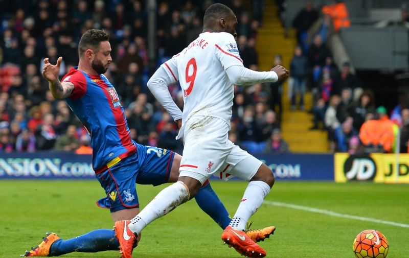 Liverpool's Zaire-born Belgian striker Christian Benteke (R) is fouled in the area by Crystal Palace's Irish defender Damien Delaney leading to a penalty that Benteke converts during the English Premier League football match between Crystal Palace and Liverpool at Selhurst Park in south London on March 6, 2016.
Liverpool won the game 2-1. / AFP / GLYN KIRK / RESTRICTED TO EDITORIAL USE. No use with unauthorized audio, video, data, fixture lists, club/league logos or 'live' services. Online in-match use limited to 75 images, no video emulation. No use in betting, games or single club/league/player publications.  /