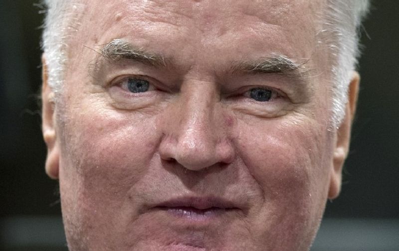 Former Bosnian Serb commander Ratko Mladic enters the International Criminal Tribunal for the former Yugoslavia (ICTY), on November 22, 2017, to hear the verdict in his genocide trial.
Dubbed "The Butcher of Bosnia," Mladic's trial is the last before the ICTY, and the judgement has been long awaited by tens of thousands of victims across the bitterly-divided region, seeking to close a chapter in the brutal 1990s Balkans conflicts.
 / AFP PHOTO / POOL / Peter Dejong