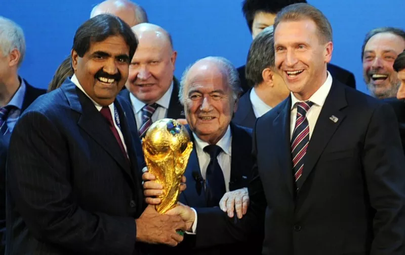 (FILES) -- A file photo taken on December 2, 2010 shows the Emir of the State of Qatar Sheikh Hamad bin Khalifa Al-Thani (L), Fifa President Sepp Blatter (C) and Russia's Deputy Prime Minister Igor Shuvalov posing with the World Cup following the announcement that Russia and Qatar will host the 2018 and 2022 World Cups on at the FIFA headquarters in Zurich. Sepp Blatter on June 2, 2015 resigned as president of FIFA as a mounting corruption scandal engulfed world football's governing body. The 79-year-old Swiss official, FIFA president for 17 years and only reelected on May 29, said a special congress would be called as soon as possible to elect a successor. Blatter said that the scandal-tainted FIFA needs "profound reconstruction" and that he had "thoroughly reconsidered" his presidency since his reelection.  AFP PHOTO / PHILIPPE DESMAZES