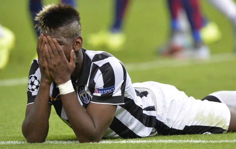 Juventus' French midfielder Paul Pogba reacts during the UEFA Champions League Final football match between Juventus and FC Barcelona at the Olympic Stadium in Berlin on June 6, 2015.     AFP PHOTO / OLIVER LANG
