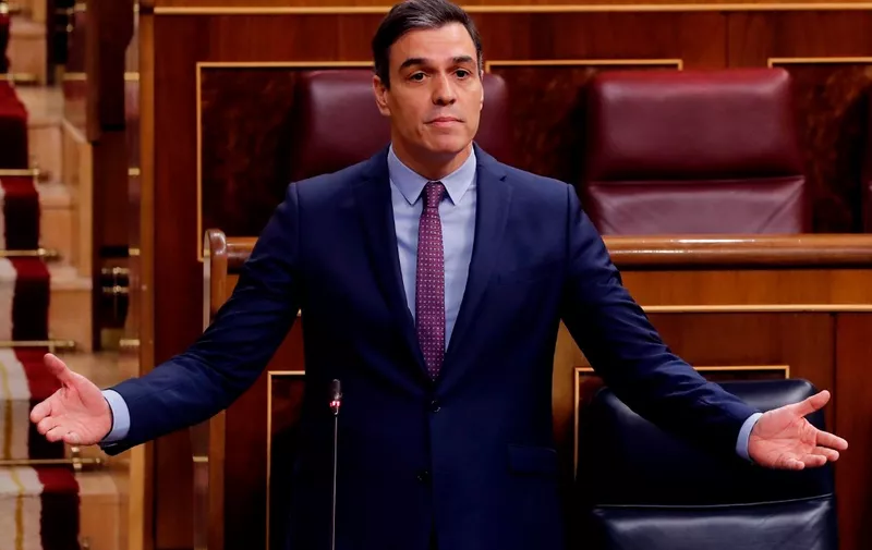 Spanish Prime Minister Pedro Sanchez addresses the first question time session held since the state of alarm was declared at the Lower Chamber of the Spanish parliament in Madrid on April 15, 2020. - Spain's daily death toll from the coronavirus fell to 523, after posting a one-day rise, bringing the total number of fatalities to 18,579, the health ministry said. (Photo by Andres BALLESTEROS / POOL / AFP)