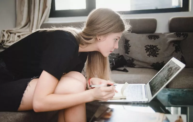 A foreign model from Ukraine, who works on camera to display clothes for online shopping sites Taobao.com and Tmall.com of Chinese e-commerce giant Alibaba Group, learns Chinese language at home in Hangzhou city, east China's Zhejiang province, 16 August 2018.

Every summer, thousands of foreign models chasing fashion success come to China, bracing for the country's e-commerce boom in the second half of the year and hoping to make a quick buck. At present, there are 10,000 foreign models nationwide. More than half are from Eastern European countries  like Russia, which accounts for 36 percent, Ukraine with 22 percent, and Belarus with 8 percent, according to a report from 1688.com, an online wholesale marketplace at Alibaba Group. Among the total figure, 3,000 models are professional models with a work visa, and the rest work part-time. The latter are usually foreign students or in China for different reasons, the report said, adding 70 percent of these foreign models work for e-commerce platforms at Alibaba, while Hangzhou, where the company is headquartered, is home to the most foreign models. In order to prepare for shopping spree "festivals" in the second half of the year, like Black Friday and Christmas, cross-border e-commerce practitioners often have to do photoshoots from August to September, providing foreign models a business opportunity. Generally, foreign models work in China for three months around summer, earning 1,000-3,000 yuan ($145.73-$437.11) per hour by showing more than 100 pieces of clothing each day. After that, they return to their home country. (Photo by Stringer / Imaginechina / Imaginechina via AFP)