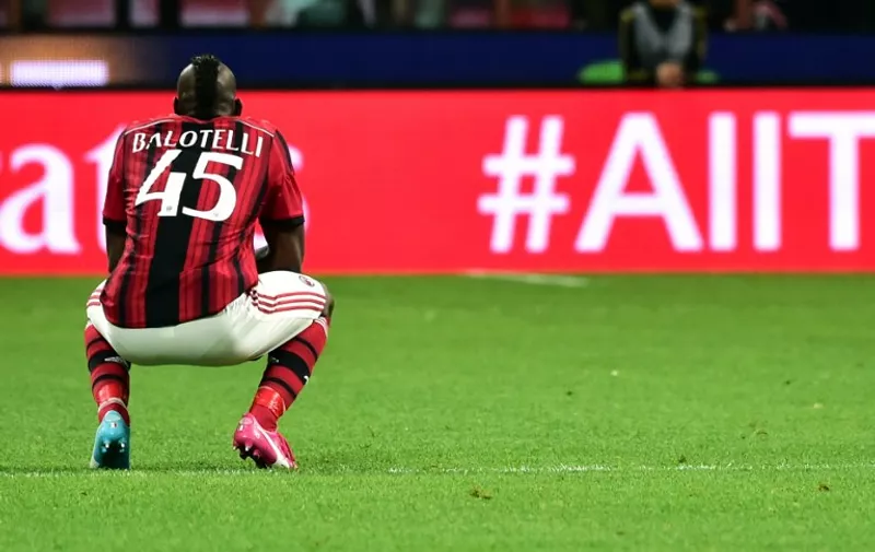 AC Milan's forwards Mario Balotelli reacts during the Italian Serie A football match between AC Milan and Sassuolo at San Siro Stadium in Milan on May 18, 2014. AFP PHOTO / GIUSEPPE CACACE