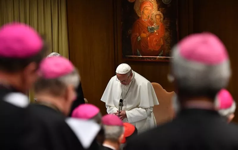 Pope Francis prays during the opening of a global child protection summit for reflections on the sex abuse crisis within the Catholic Church, on February 21, 2019 at the Vatican. - Pope Francis has set aside three and a half days to convince Catholic bishops to tackle paedophilia in a bid to contain a scandal which hit an already beleaguered Church again in 2018, from Chile to Germany and the United States. (Photo by Vincenzo PINTO / POOL / AFP)