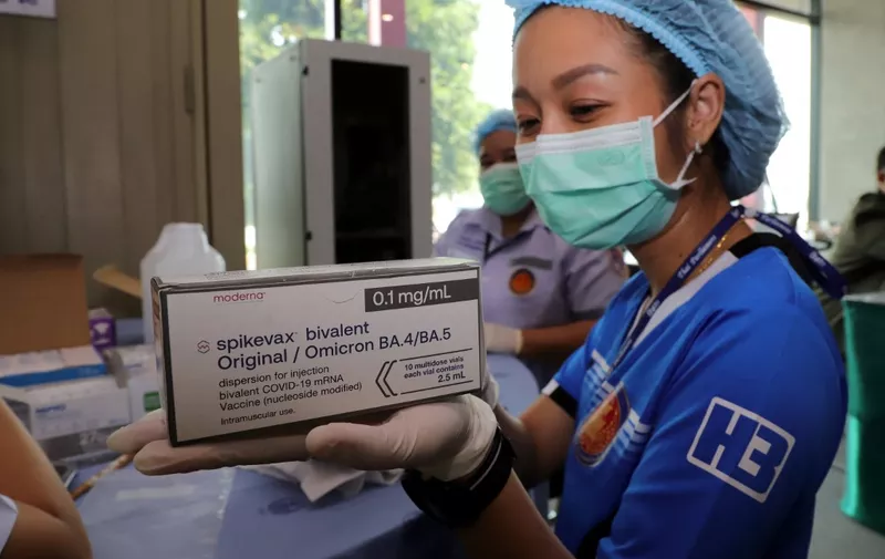  A medical worker with a box of Moderna bivalent Covid-19 vaccines being prepared on 11 May 2023 for senators, civil servants, staff and others who work for the House of Representatives.   (Photo by Chanat Katanyu / Bangkok Post / Bangkok Post via AFP)