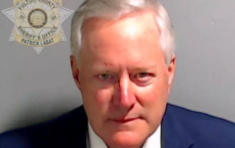 ATLANTA, GEORGIA - AUGUST 24: In this handout provided by the Fulton County Sheriff's Office, former White House Chief of Staff Mark Meadows poses for his booking photo on August 24, 2023 in Atlanta, Georgia. Former President Donald Trump and 18 others facing felony charges in the indictment related to tampering with the 2020 election in Georgia have been ordered to turn themselves in by August 25.   Fulton County Sheriff's Office via Getty Images/AFP (Photo by Handout / GETTY IMAGES NORTH AMERICA / Getty Images via AFP)