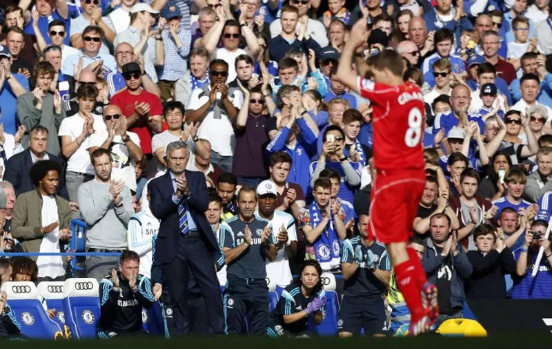 Chelsea's Portuguese manager Jose Mourinho (L) leads the applause after Liverpool's English midfielder Steven Gerrard (R) is substituted during the English Premier League football match between Chelsea and Liverpool at Stamford Bridge in London on May 10, 2015. AFP PHOTO / IAN KINGTON

RESTRICTED TO EDITORIAL USE. No use with unauthorized audio, video, data, fixture lists, club/league logos or live services. Online in-match use limited to 45 images, no video emulation. No use in betting, games or single club/league/player publications.