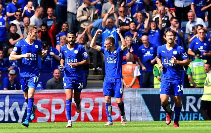 Leicester City's English striker Jamie Vardy (2nd R) celebrates after scoring the opening goal during the English Premier League football match between Leicester City and Sunderland at King Power Stadium in Leicester, central England on August 8, 2015. AFP PHOTO / BEN STANSALL

RESTRICTED TO EDITORIAL USE. No use with unauthorized audio, video, data, fixture lists, club/league logos or 'live' services. Online in-match use limited to 75 images, no video emulation. No use in betting, games or single club/league/player publications.