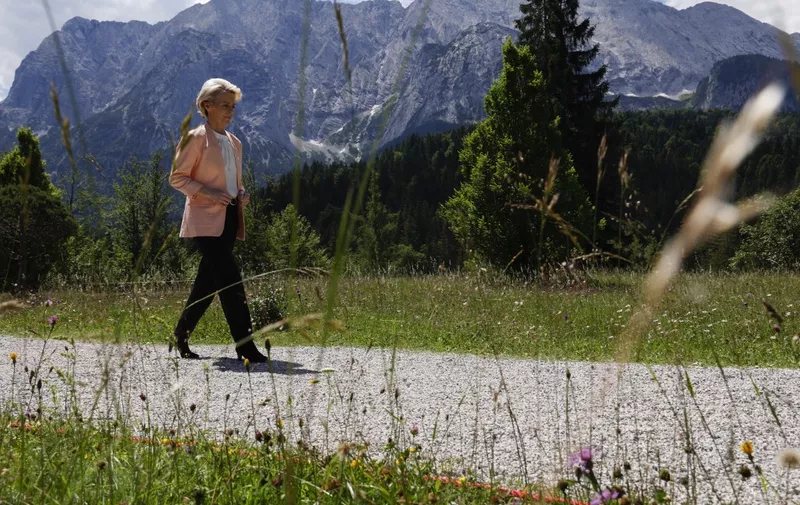 European Commission President Ursula von der Leyen walks to the welcoming ceremony at the start of the G7 Summit at Elmau Castle, southern Germany on June 26, 2022. (Photo by JONATHAN ERNST / POOL / AFP)