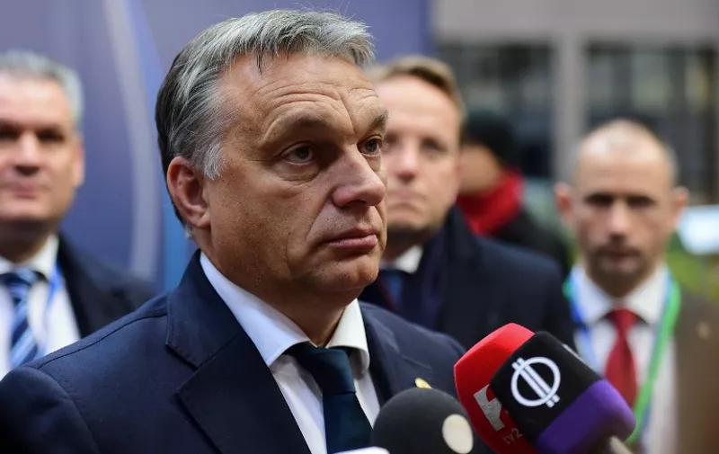 Hungarian Prime Minister  Viktor Orban arrives to take part in a European Union (EU) summit dominated by the migration crisis at the European Council in Brussels, on October 15, 2015.  AFP PHOTO / EMMANUEL DUNAND