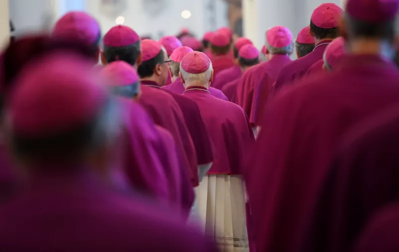 Members of the German Bishops' Conference enter the cathedral to attend the opening mass of the conference on September 25, 2018 in Fulda, western Germany. - Germany's Catholic Church is due on September 25, 2018 to confess and apologise for thousands of cases of sexual abuse against children, part of a global scandal heaping pressure on the Vatican. It will release the latest in a series of reports on sexual crimes and cover-ups spanning decades that has shaken the largest Christian Church, from Europe to the United States, South America and Australia. (Photo by Arne Dedert / dpa / AFP) / Germany OUT